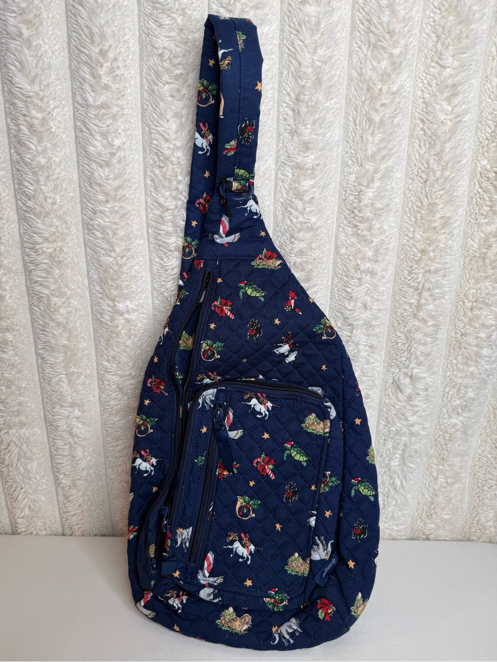 Vera Bradley Navy Blue Quilted
Snow Globe Motifs Sling Backpack
